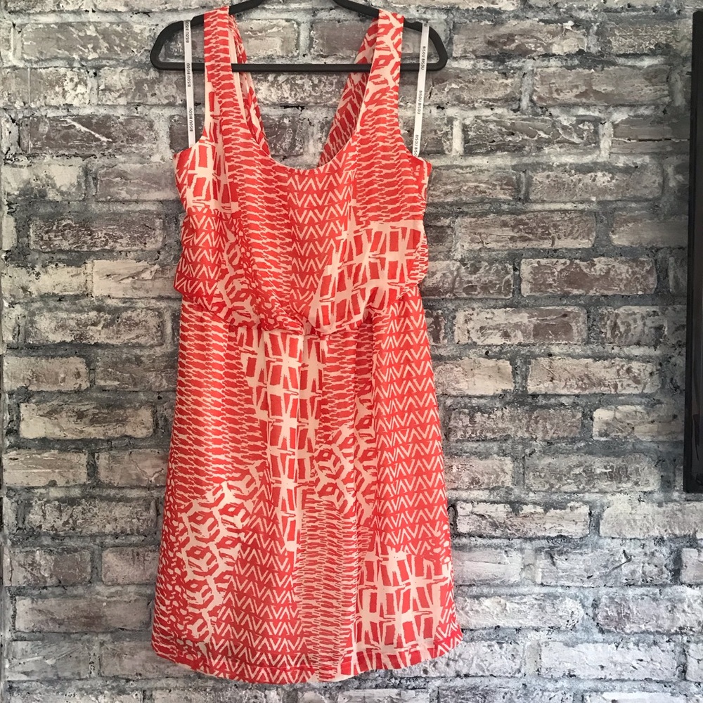 Beautiful NWOT vibrant dress. Back is draped, lined and comfy material